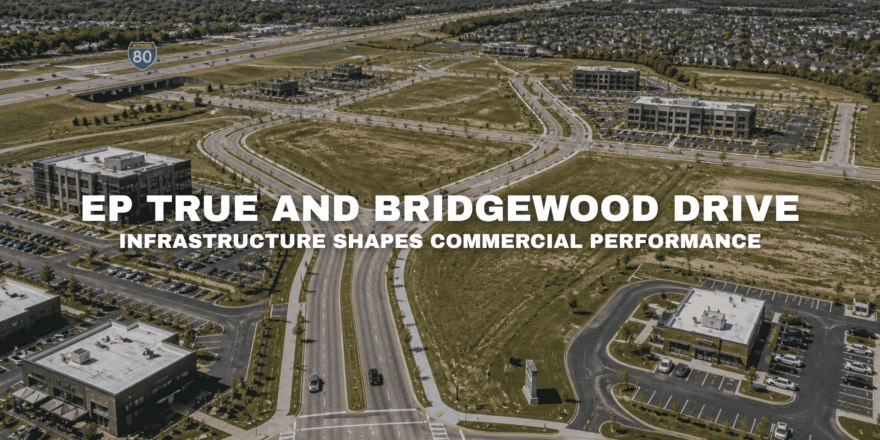 Aerial view of Pavilion Park in West Des Moines with broad roads, open commercial parcels, office buildings, landscaped medians, surrounding neighborhoods, and nearby Interstate 80 access.
